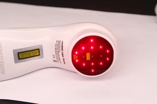 A white red light handheld device shining towards the camera.